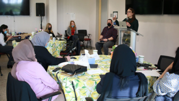 Photo of Allie Smith leading a workshop on advocacy in the United States for evacuated Afghan women leaders.